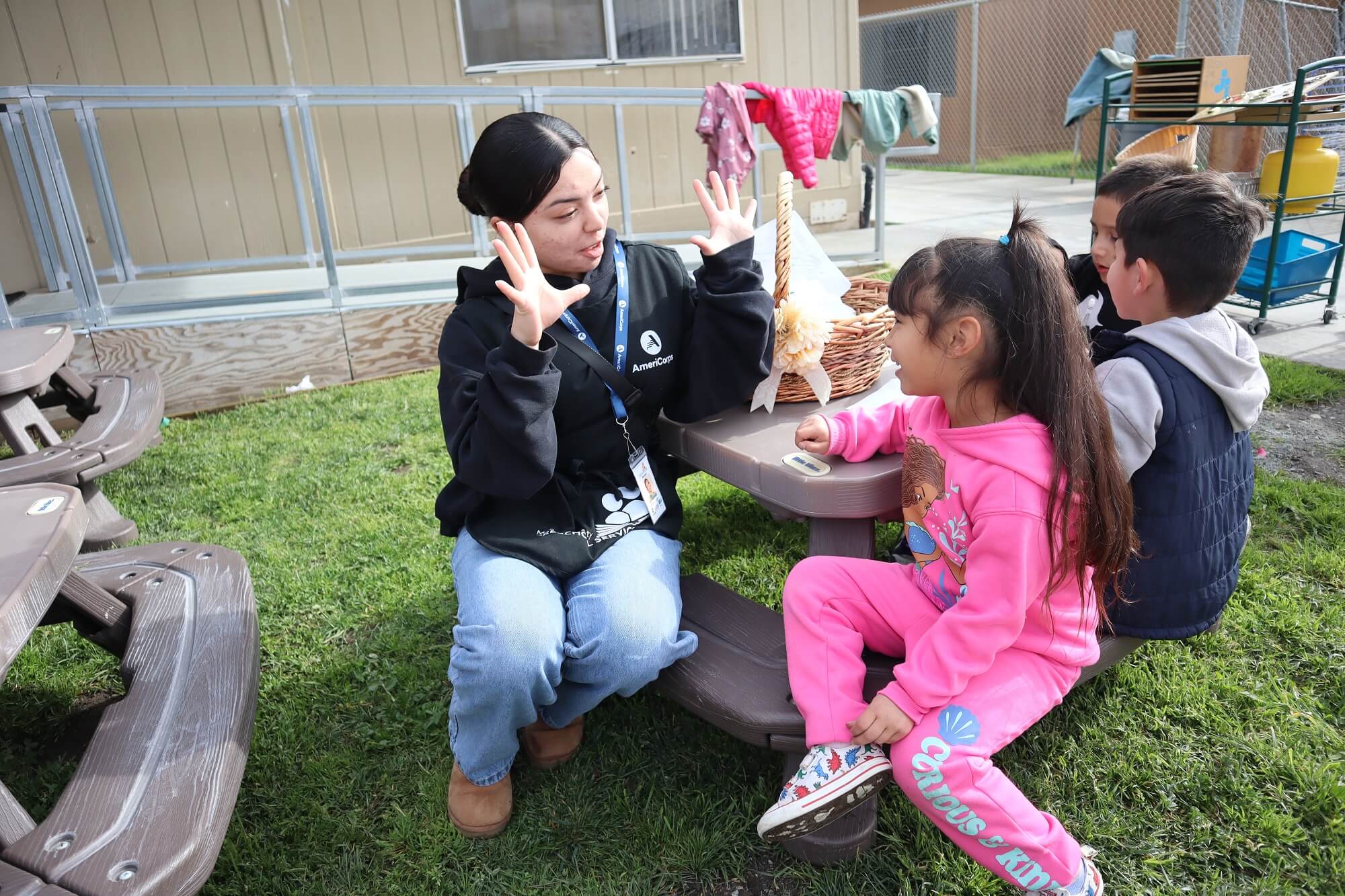 Preschool Service Corps member interacting with a preschool student